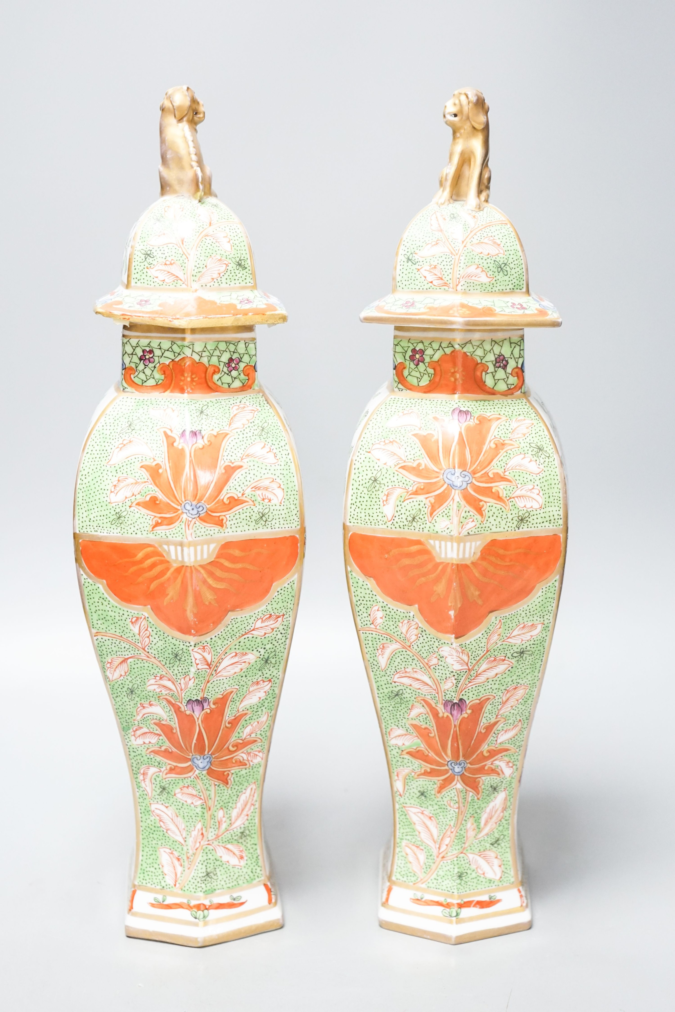 A pair of Samson kakiemon style lidded hexagonal baluster vases 41cm